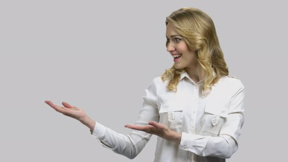 Happy Young Woman Raises Her Arms and Turning Palms Up