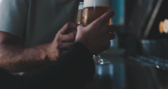 Two friends enjoying a crafted lager beer in a modern urban bar