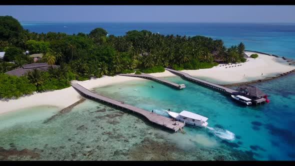 Aerial above travel of tropical lagoon beach trip by clear sea with white sandy background of a dayo