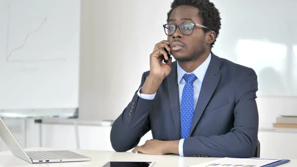 African Businessman Talking on Phone