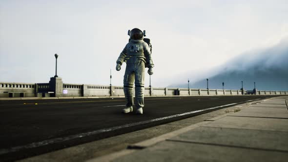 Astronaut in Space Suit on the Road Bridge