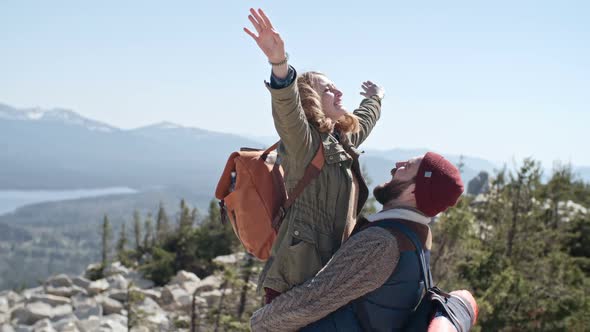 Man Lifting Up Girlfriend on Hiking Trip