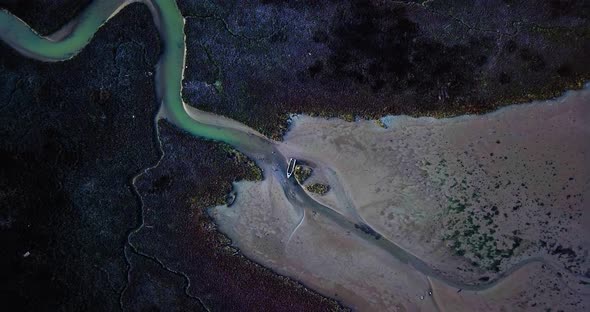 Broken Motorboat Body Near River on Polluted Sandy Beach