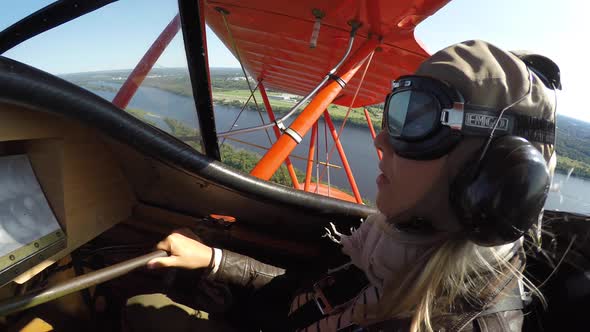 biplane cute girl in vintage getup flying 4k