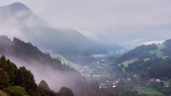 Foggy Morning In A Mountain Forest Village