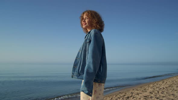 Attractive Girl Enjoying Sunny Day on Seacoast