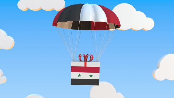 Carton with Flag of Syria Falls with a Parachute