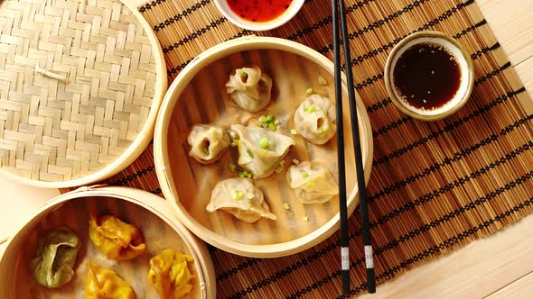 Oriental Traditional Chinese Dumplings Served in the Wooden Steamer