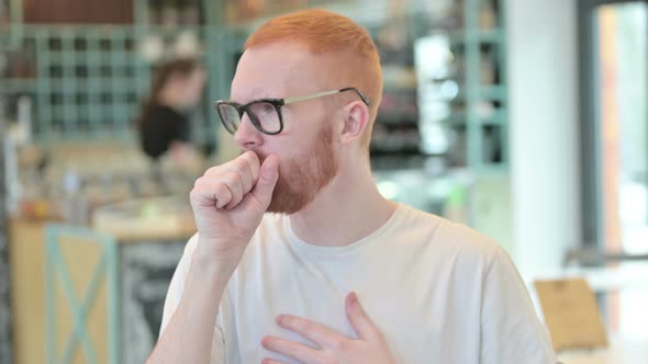 Portrait of Sick Redhead Man Coughing 