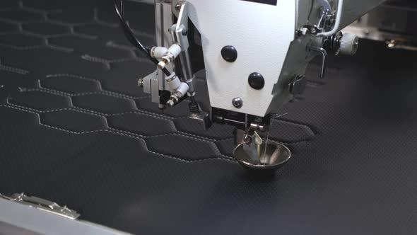 Automated Machine Embroider Pattern on Artificial Leather. Robotics Works in the Tailoring