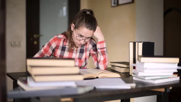 Student girl in correspondence studies studying the material. Distance learning