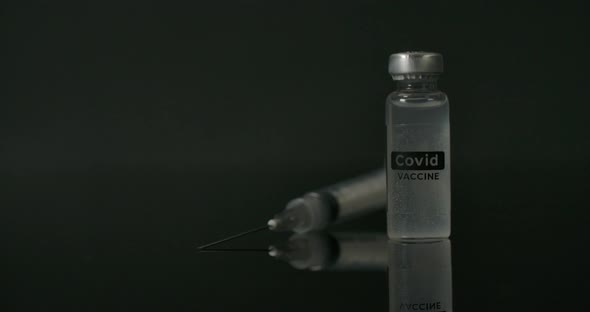 Covid Vaccine And Syringe