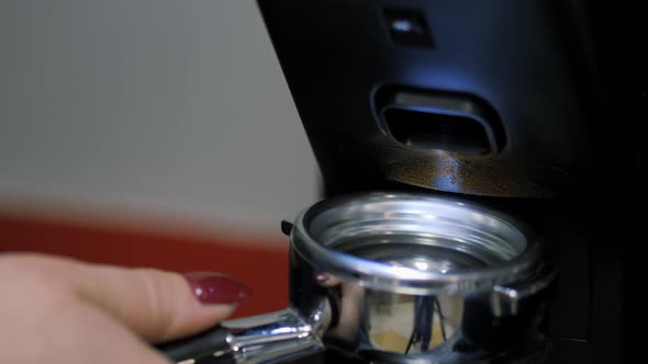 Process of Semiautomatic Filling of Ground Coffee Beans Into a Mold for a Coffee Machine