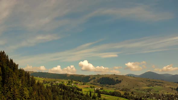 Countryside Landscape Under Blue Sky and Dramatic White Clouds