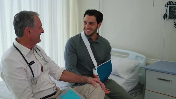 Doctor and patient with broken arm