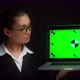 Business Woman Shows a Green Laptop Screen with Tracking Markers - VideoHive Item for Sale