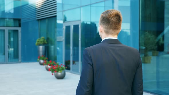 Young Businessman Commuting To Work. Confident Guy in Suit Being on His Way To Office. Business Man