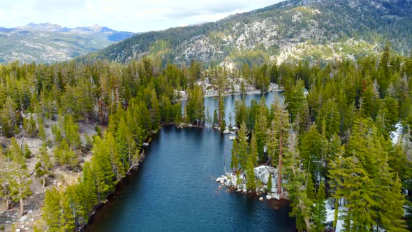 Aerial Flight Over the Lake in the Mountains of California