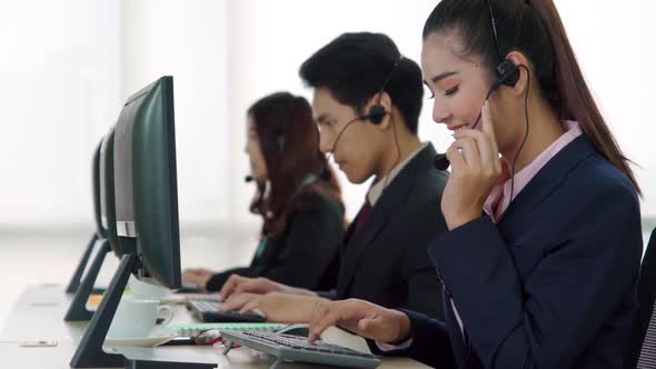 Business People Wearing Headset Working in Office