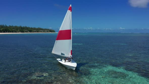 An Elderly Man Drives a Sailing Yacht