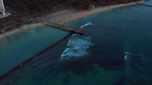 Aerial drone footage of Honolulu, Hawaii. Beautiful real estate, buildings in the city. Palm trees