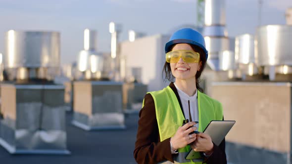 Young Woman Engineer with a Large Smile Wearing