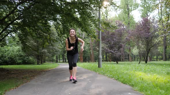 4K steady footage of a young girl jogging in the park