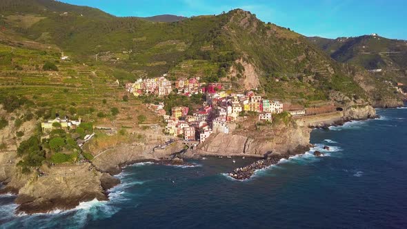 Aerial View of Manarola Village on Cliff Rocks and Turquoise Sea