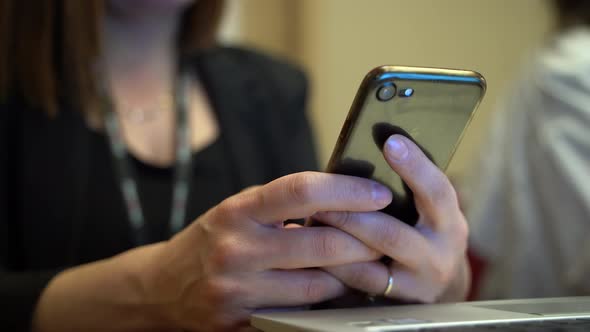 Business Woman Messaging on Phone at Meeting 4K