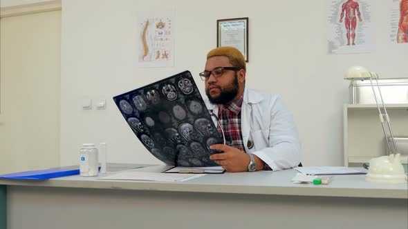 Male Doctor Worrying About Brain Xray Results