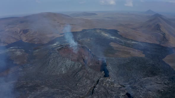 Aerial View Above Fagradalsfjall Volcanic Fissure Eruption Cone Fumes Tilt Down Reveal Inside of