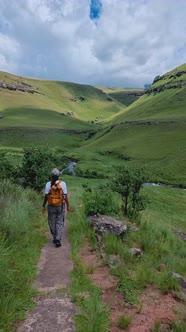 Young Woman Hiking in the Mountains of Drakensberg South Africa