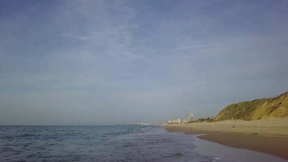 Sliding By the Coastline of Empty Off Season Mediterrian Beach