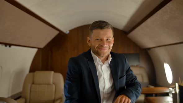 Happy Business Man Dancing Inside of Luxury Jet