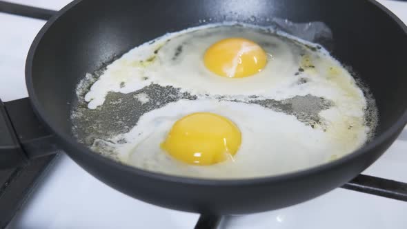 Fried egg in the hot pan.