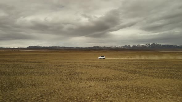 A White 4X4 Car Moves at High Speed Offroad