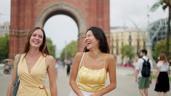 Two Mixedraces Young Happy Woman Laughing at Joke While Travelling and Sightseeing in City