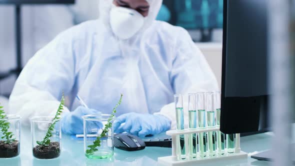 Close Up Footage of Chemist Desk with Test Sample Plants