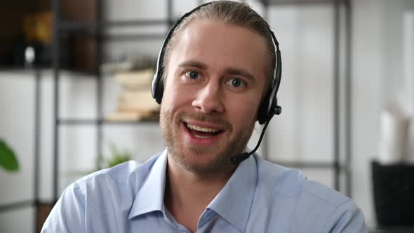 Closeup of an Attractive Bearded Friendly Operator of Call Center Expert Support Service Worker or