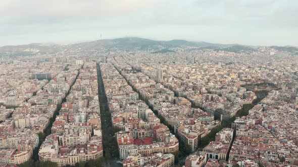 Rising drone shot over Barcelona Grid building squares