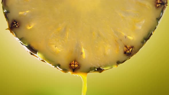 Flowing Pineapple Juice From Pineapple Slice Macro Shot in Slow Motion