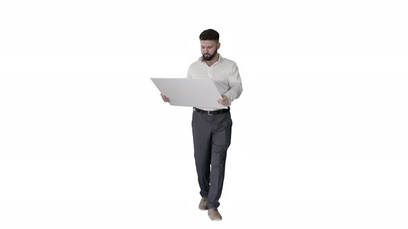 Business Man Walking and Looking at Blueprint on White Background