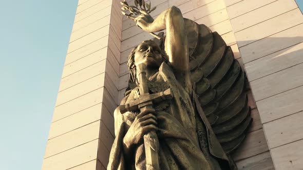 Protector angel bronze statue of monument in Flag Square, Santo Domingo. Low angle