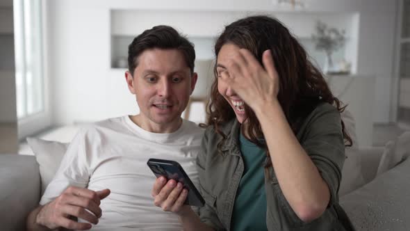 Married Woman and Man Smile Happily Reading Good News