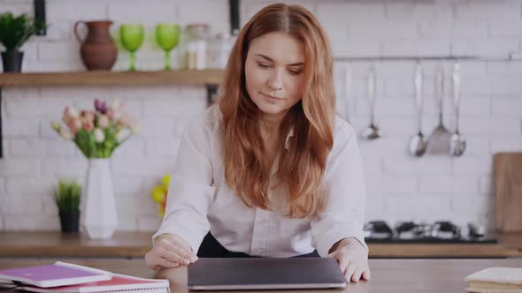 Businesswoman Watching Educational Lecture at Home