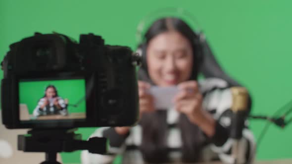 Camera Monitor Of Happy Woman Celebrating Winning The Mobile Phone Game On Green Screen Background