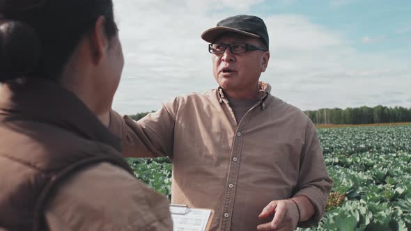 Farm Workers Discussing Something