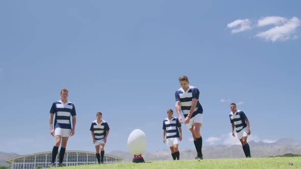 Rugby players playing on field