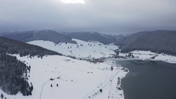 Snowy Landscape Background With High Mountains During Winter - Aerial Shot