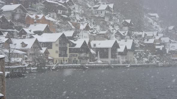 Pan right of houses on the shore of Hallstatt Lake